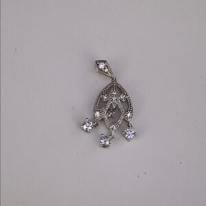 Intricate Silver Brooch with Crystal Details